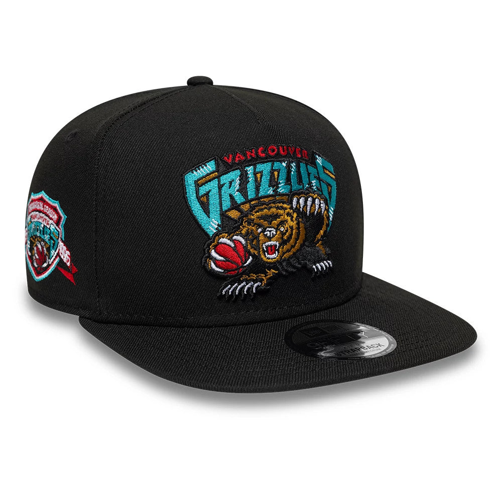 Vancouver Grizzlies NBA Hardwood Classic Black New Era 9FIFTY A-Frame Snapback Adjustable Cap, three-quarter view showing the embroidered team bear logo in turquoise and brown on the front panel, flat black visor with 9FIFTY size sticker.