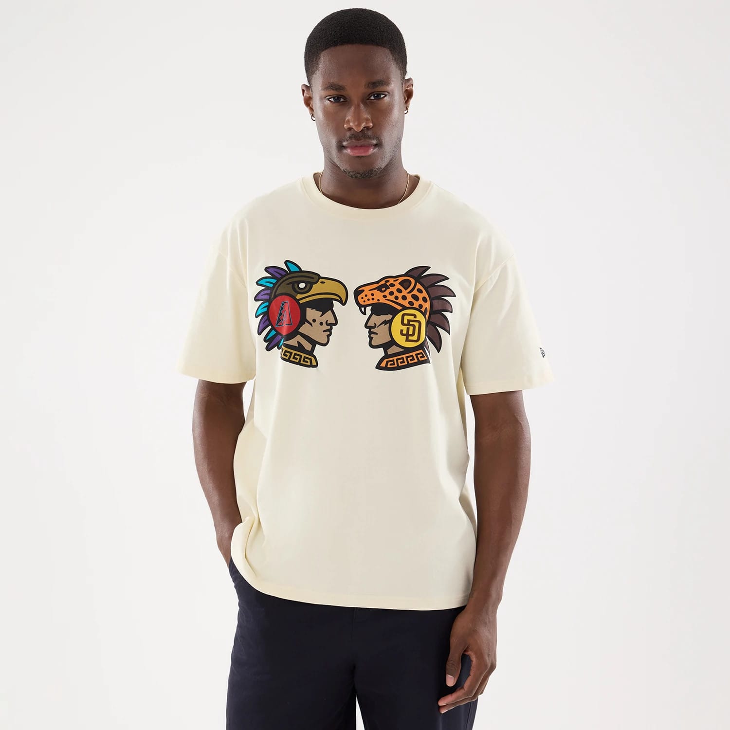 The model is wearing this MLB Mexico City Series 2026 Clash MLB Dueling Logo T-Shirt in Cream 1