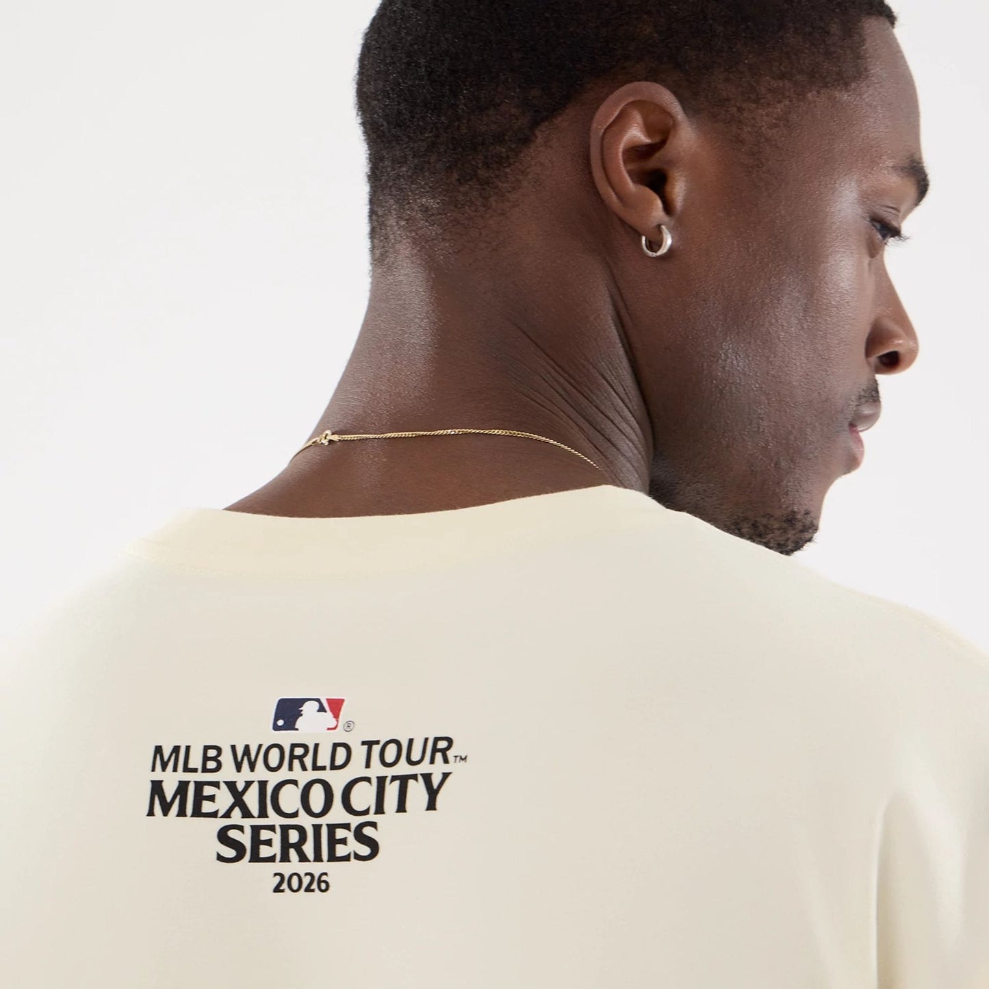 The model is wearing this MLB Mexico City Series 2026 MLB Dueling Logo T-Shirt in Cream 7