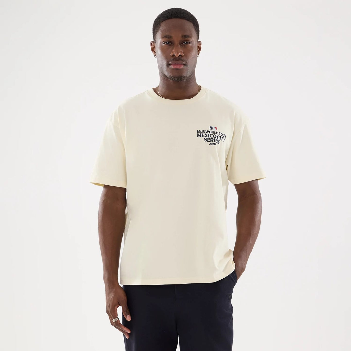 The model is wearing this MLB Mexico City Series 2026 Script Dueling Logo T-Shirt in Cream. 7