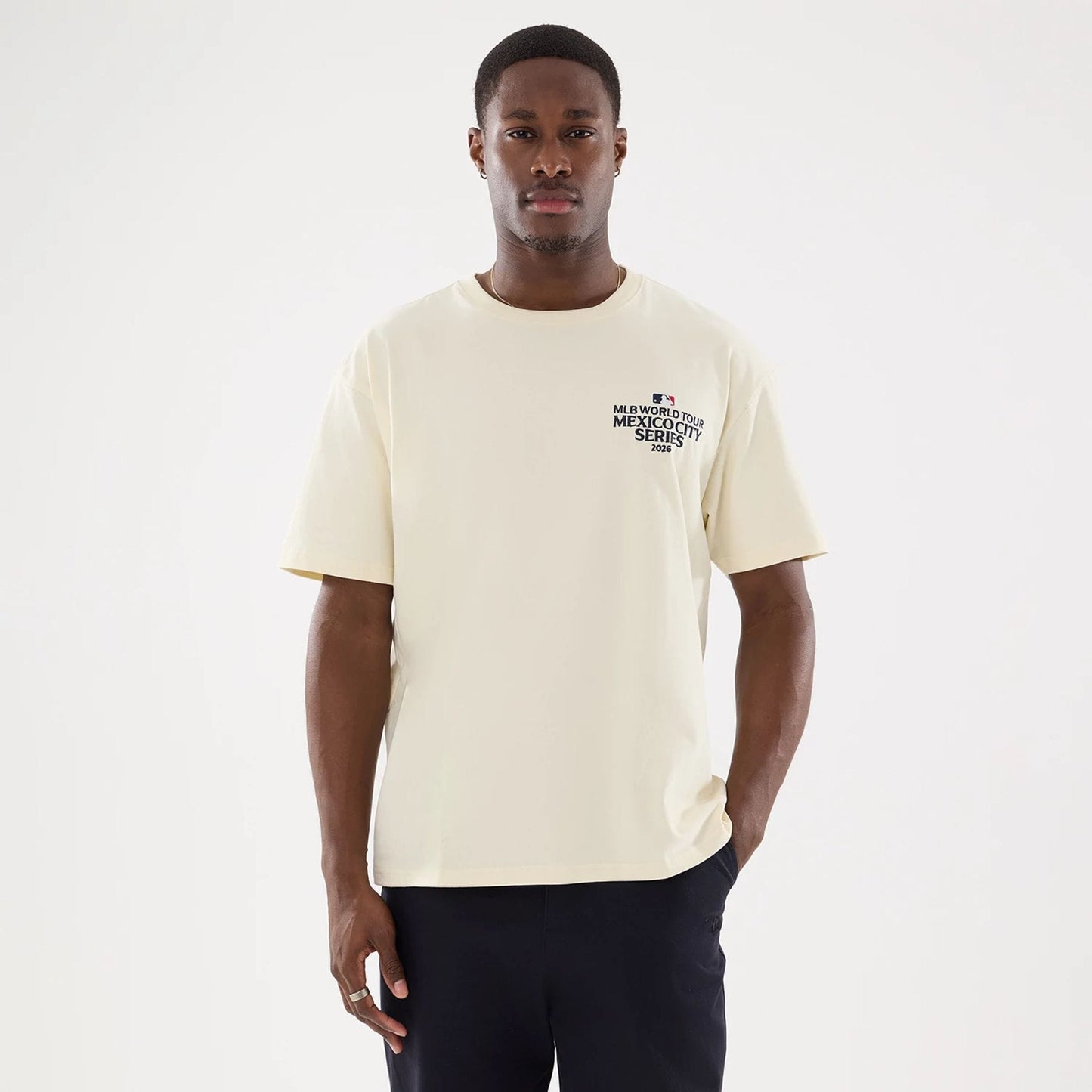 The model is wearing this MLB Mexico City Series 2026 Dueling Logo T-Shirt in Cream. 7
