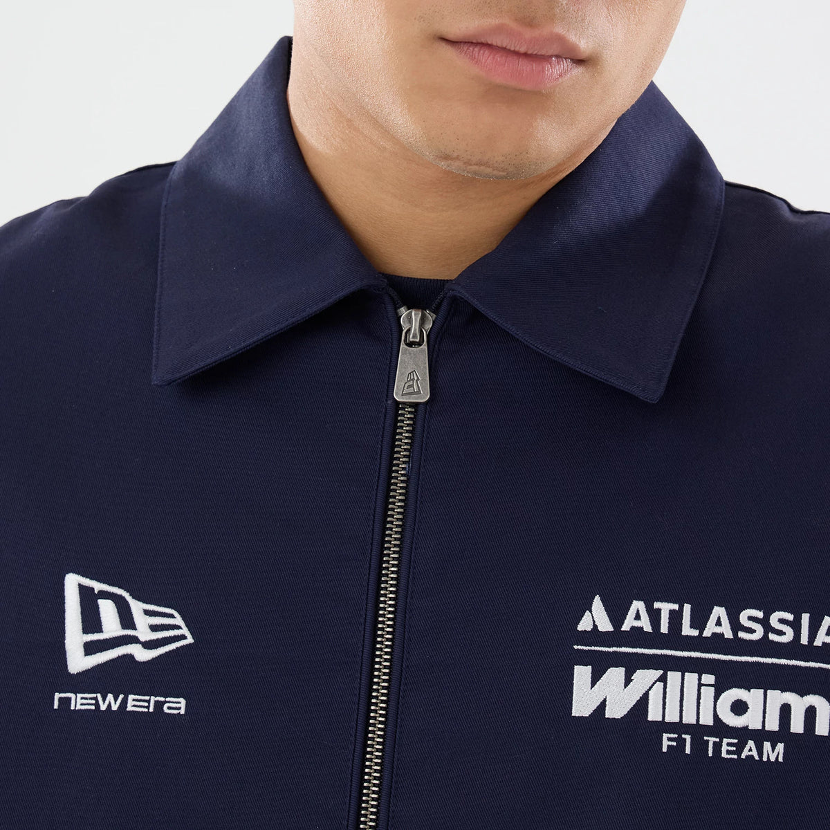 New Era Williams GB Race Special Navy Collared Jacket, front view highlighting the full zip closure with a pull, an embroidered New Era logo on the left chest, and the embroidered Williams F1 Team and Atlassian logos on the right chest.