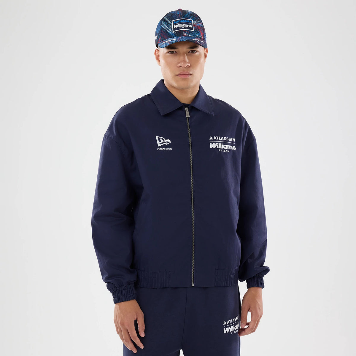 The model is wearing this Williams GB Race Special Collared Jacket in navy. 1