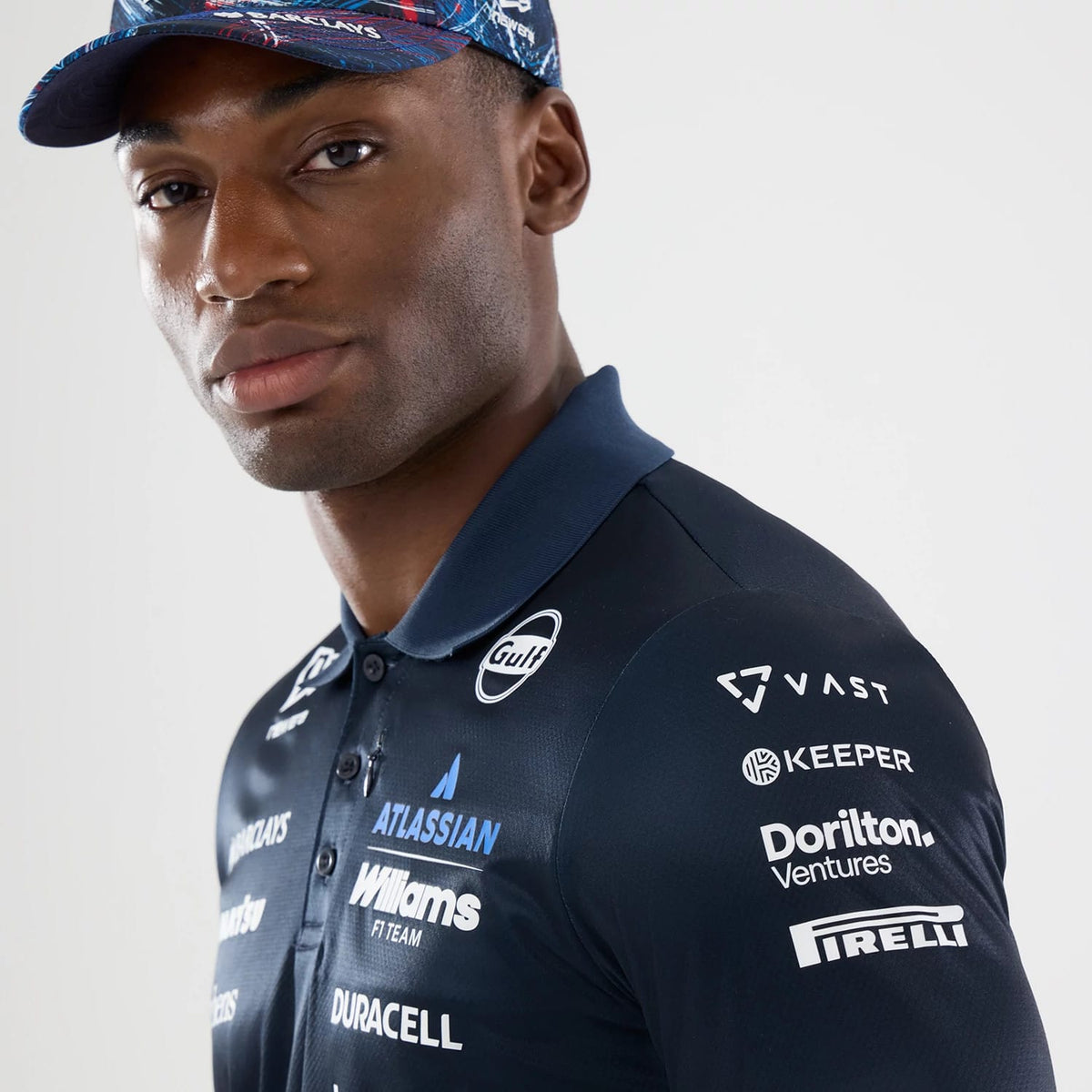 The model is wearing this Williams GB Race Special Tech Polo T-Shirt in navy. 4