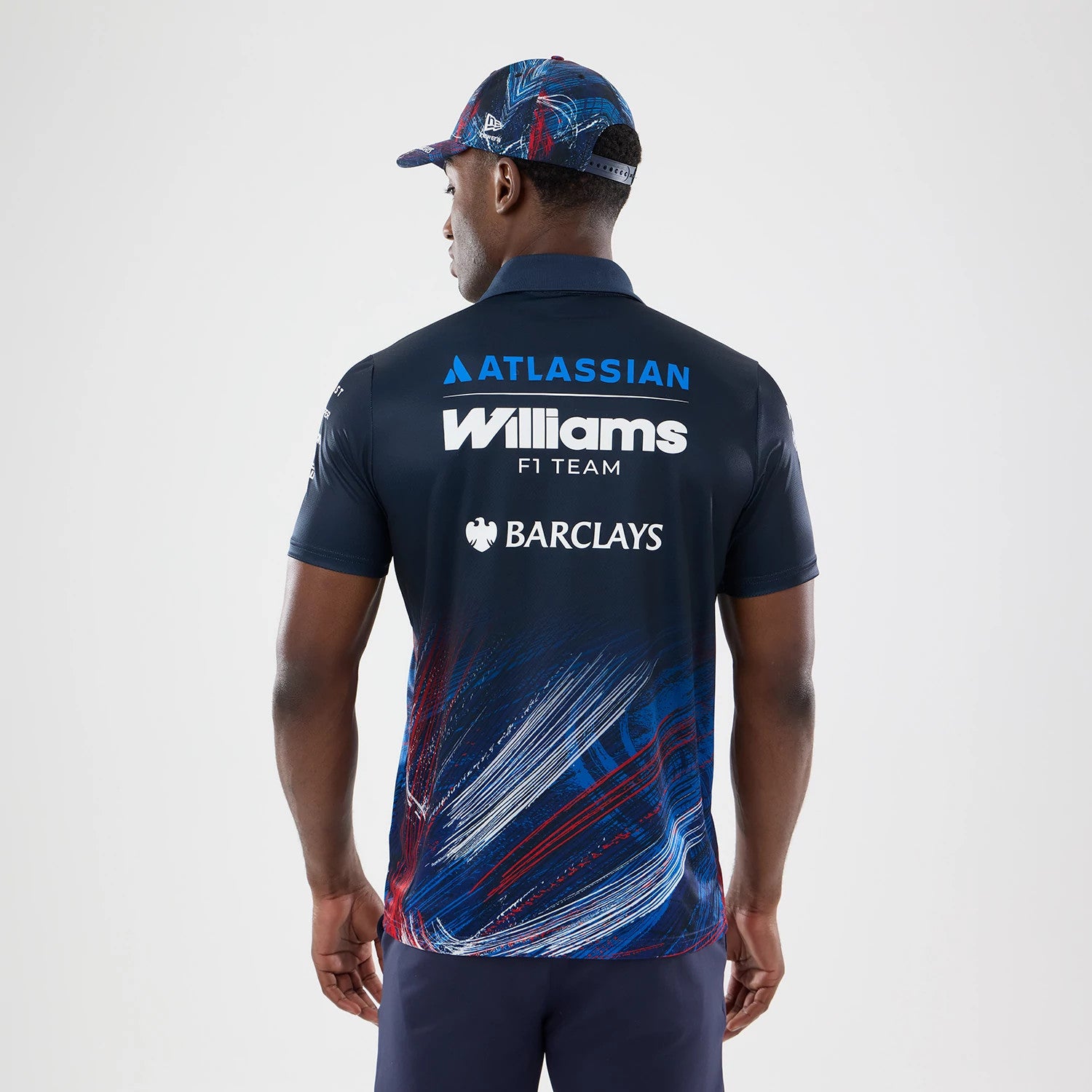 The model is wearing this Williams GB Race Special Tech Polo T-Shirt in navy. 2