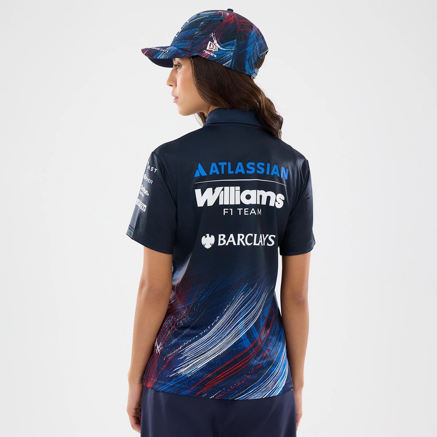 The model is wearing this Womens Williams GB Race Special Tech Polo T-Shirt in navy. 2