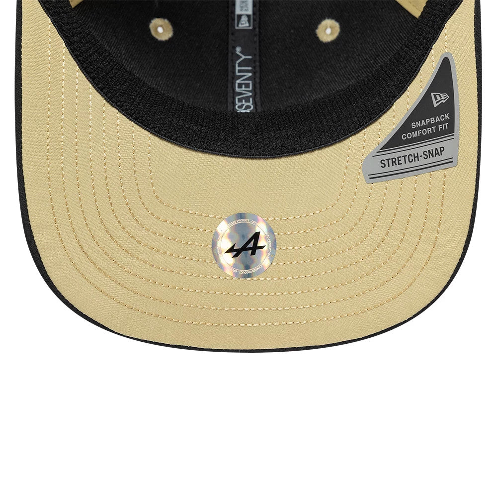 Alpine Racing Latin American Franco Colapinto Light Beige New Era 9SEVENTY Stretch Snap Adjustable Cap, inside view showing the black sweatband, beige undervisor with an A logo sticker, and New Era taping along the inner panels.