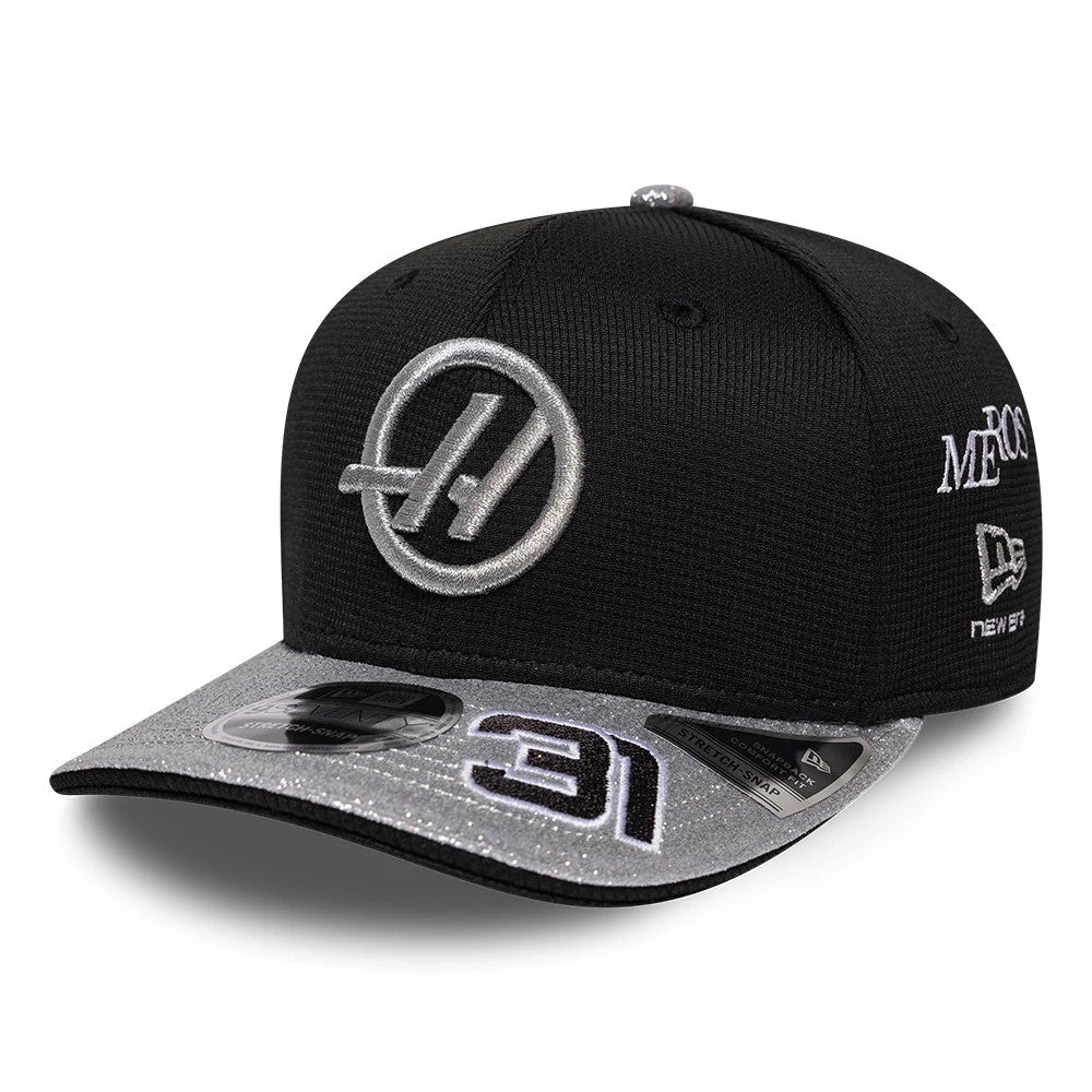 TGR Haas F1 Esteban Ocon Vegas Race Special Black New Era 9SEVENTY Stretch Snap Adjustable Cap, front view showing a silver embroidered Haas logo on the front panel, with a glittery grey visor featuring a black and white 31 and 9SEVENTY size sticker.
