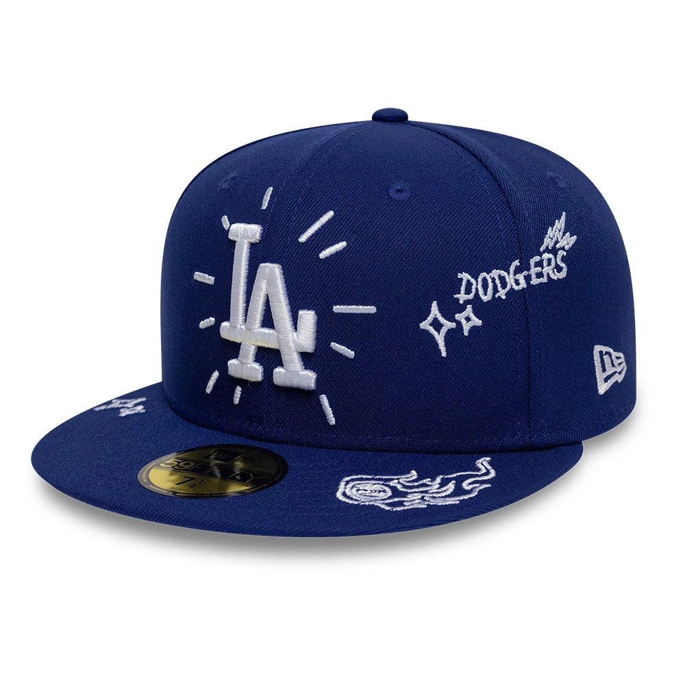 LA Dodgers MLB Scribble Dark Blue New Era 59FIFTY Fitted Cap, three-quarter view showing the raised white embroidered LA logo with surrounding lines on the front panel, white scribble designs on the dark blue visor and a gold 59FIFTY size sticker.