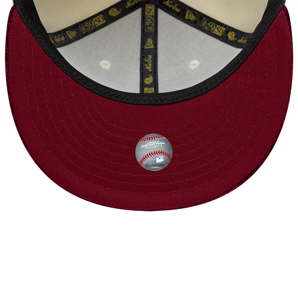 LA Dodgers MLB Paisley Visor Cream New Era 59FIFTY Fitted Cap, inside view showing a red undervisor with a baseball-themed holographic sticker at the centre, contrasted by black and gold taping along the seams and a beige sweatband.