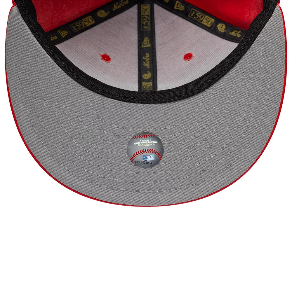 New York Yankees MLB Leather Red New Era 59FIFTY Fitted Cap, inside view showing the grey undervisor with a baseball-themed sticker, red inner fabric, and black taping adorned with gold 59FIFTY logos along the seams.