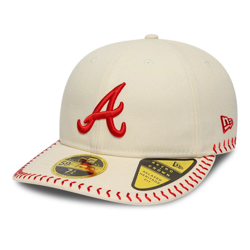 Atlanta Braves MLB Baseball Stitch Cream Retro Crown New Era 59FIFTY Fitted Cap, front view showing a red embroidered A logo on the structured cream crown, cream visor with red baseball stitching, and a gold 59FIFTY size sticker.