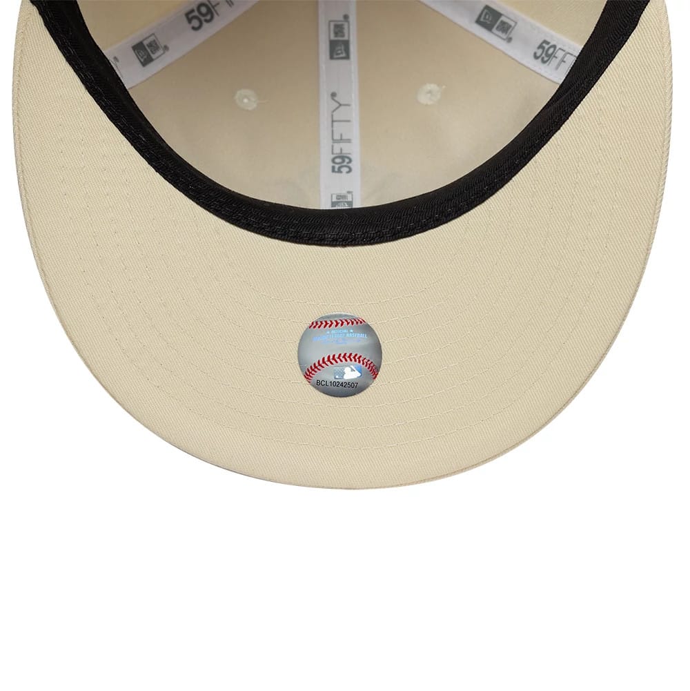 Pictured is this MLB Baseball Stitch New York Yankees Retro Crown 59FIFTY Fitted cap in Cream. 7