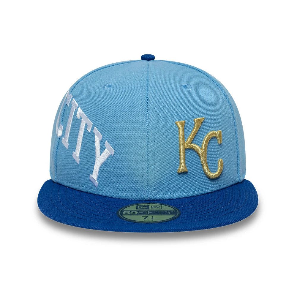 Kansas City Royals MLB Multi Logo Satin Lined Pastel Blue New Era 59FIFTY Fitted Cap, front view showing gold raised KC embroidery on the right front panel, large white CITY lettering across the left panels.