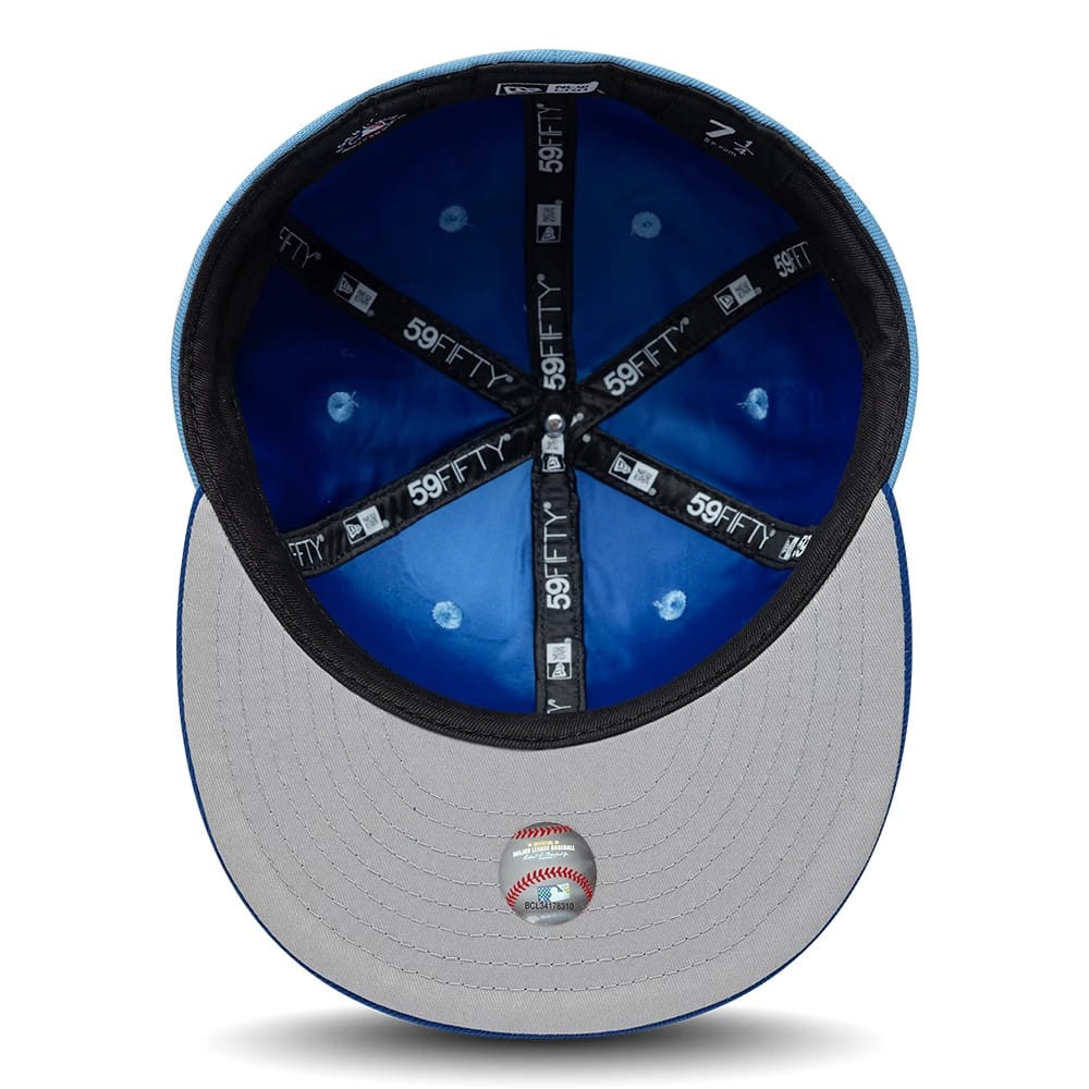 Pictured is this MLB Multi Logo Kansas City Royals 59FIFTY Fitted cap in pastel blue. 2