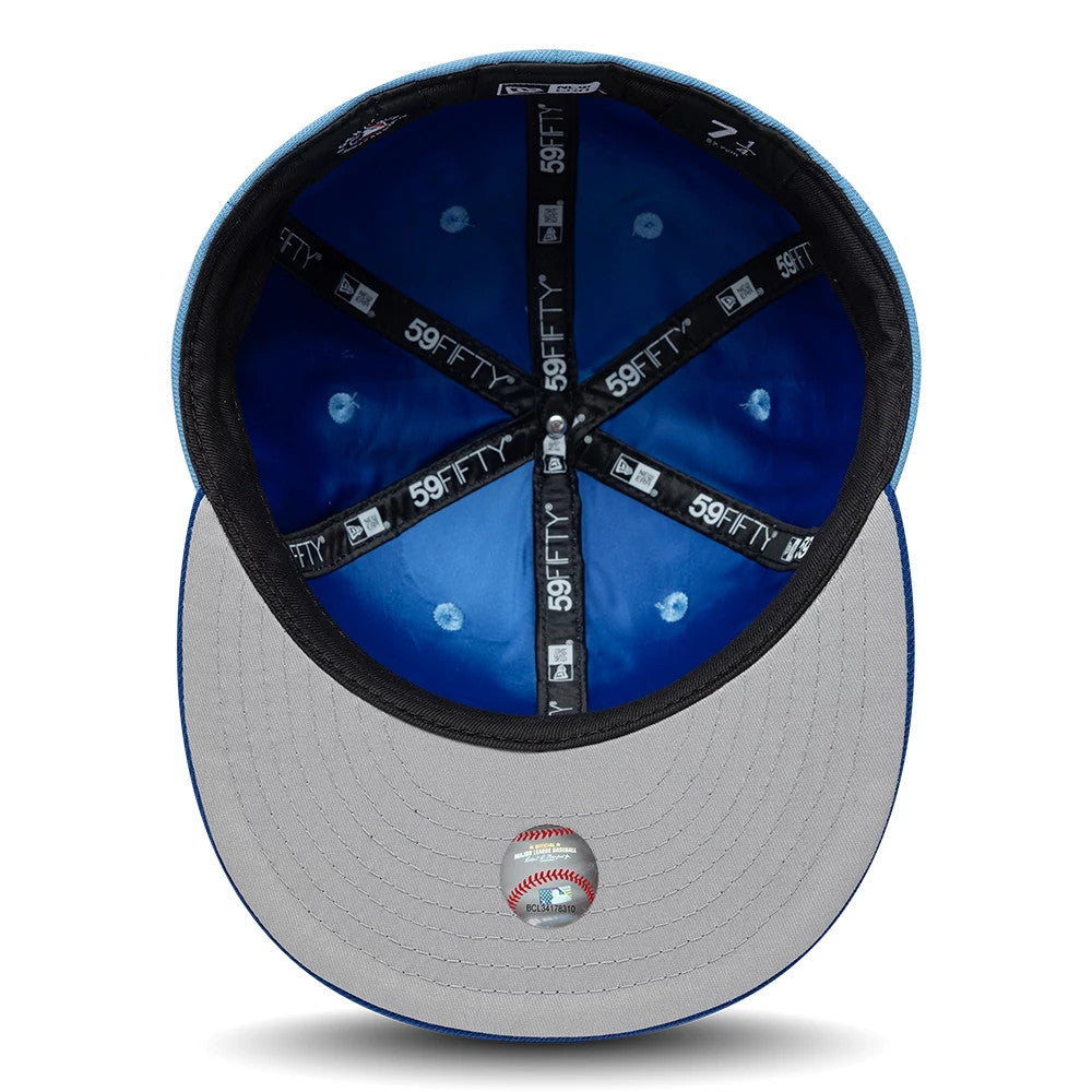 Pictured is this MLB Multi Logo Kansas City Royals 59FIFTY Fitted cap in pastel blue. 2