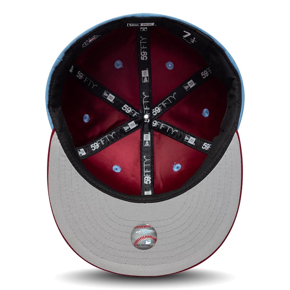 Pictured is this MLB Multi Logo Philadelphia Phillies 59FIFTY Fitted cap in pastel blue. 2