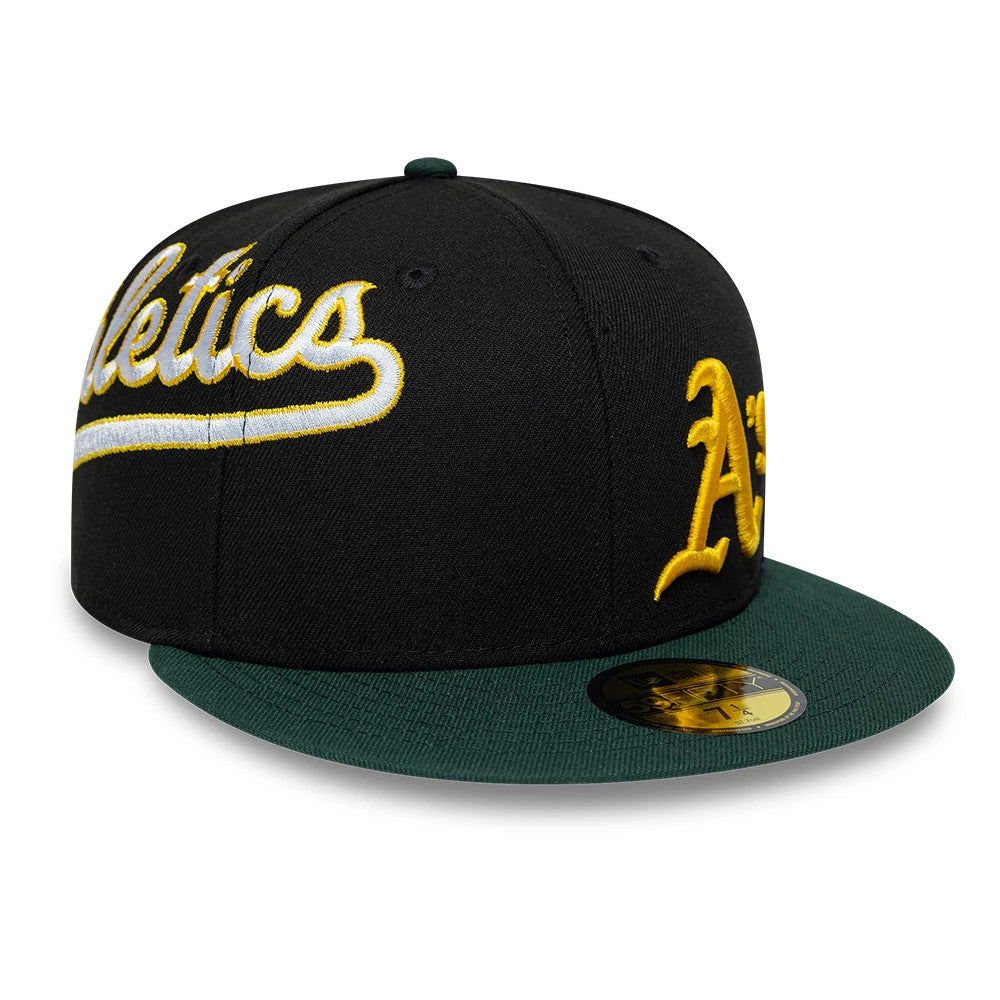 Athletics MLB Multi Logo Satin Lined Black New Era 59FIFTY Fitted Cap, three-quarter view showing the large yellow and white embroidered Athletics script on the front panel, with a green visor and gold 59FIFTY size sticker.