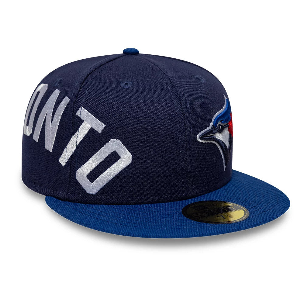 Toronto Blue Jays MLB Multi Logo Satin Lined Navy New Era 59FIFTY Fitted Cap, three-quarter view showing the white TORONTO lettering on the navy crown, the blue jay logo in raised embroidery on the side.
