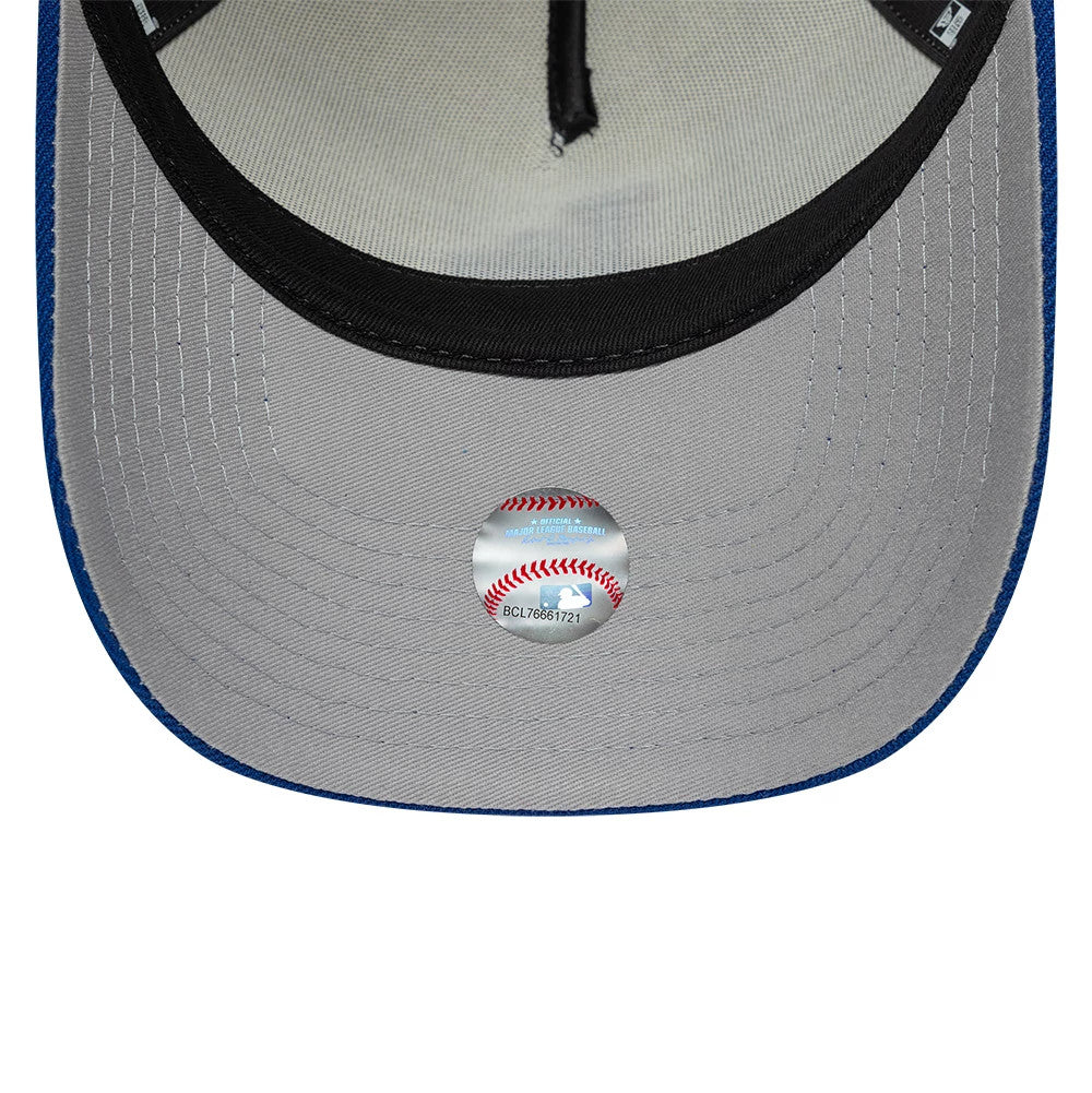 LA Dodgers MLB Side Hit Cream New Era 9FORTY E-Frame Adjustable Cap, inside view showing a grey undervisor with black sweatband, contrasting black taping, and the official silver MLB sticker with red baseball stitching on display.