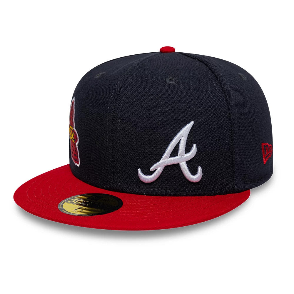 Atlanta Braves MLB Multi Logo Satin Lined Navy New Era 59FIFTY Fitted Cap, three-quarter view showing the raised white embroidered A logo on the front panel, red visor with a gold 59FIFTY size sticker, and red New Era flag logo on the left side.