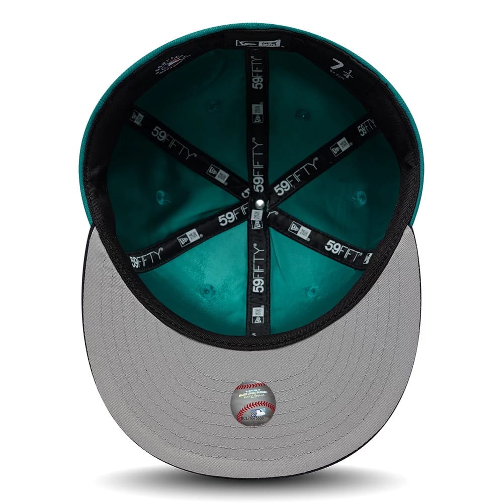 Pictured is this MLB Multi Logo Seattle Mariners 59FIFTY Fitted cap in green. 2