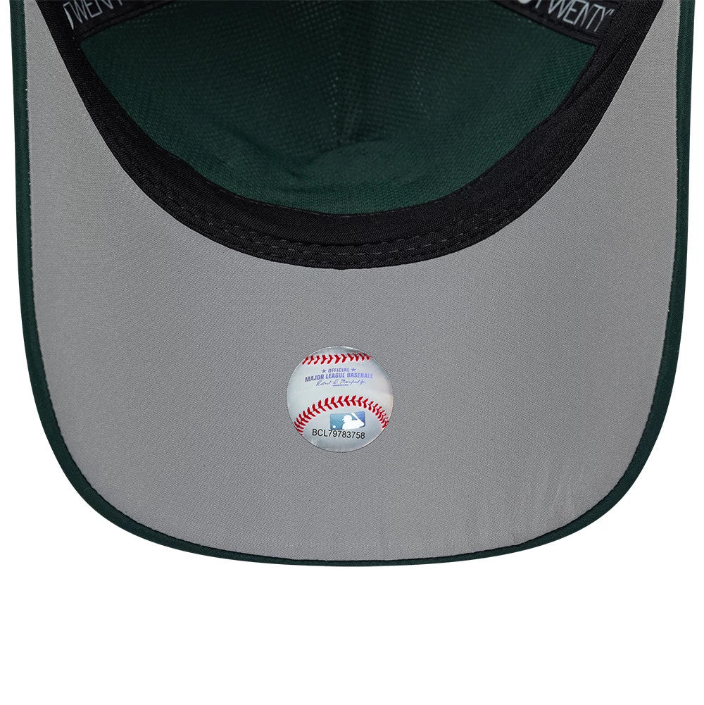 Athletics MLB Panel Dark Green New Era 9TWENTY A-Frame Adjustable Cap, inside view showing the green undervisor, the black sweatband with white stitching on the taping, and a baseball-themed holographic sticker at the centre.