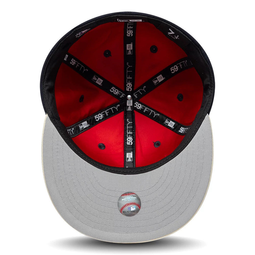 New York Yankees MLB Multi Logo Satin Lined Navy New Era 59FIFTY Fitted Cap, inside view showing the bright red satin lining, black 59FIFTY branded taping across the panels, and the grey undervisor with a baseball graphic sticker at the centre.