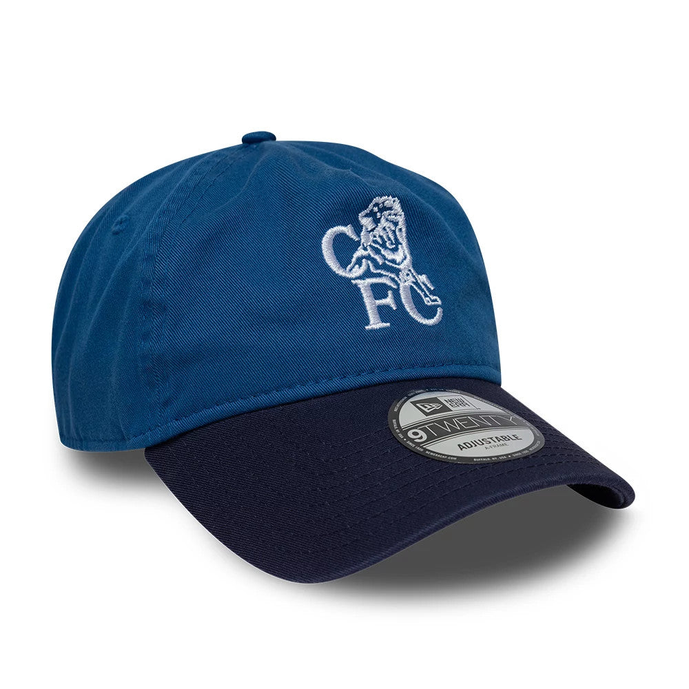 Chelsea FC Retro Goal Keeper Blue New Era 9TWENTY A-Frame Adjustable Cap, three-quarter view showing raised white embroidered CFC lion logo on front panel, dark blue curved visor with 9TWENTY size sticker, and matching blue top button.