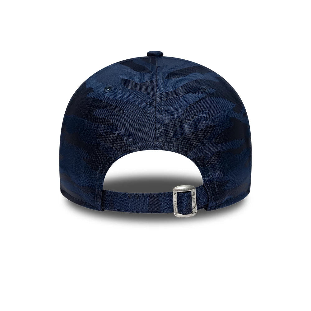 24HR Le Mans Camo Dark Blue New Era 9FORTY Adjustable Cap, rear view showing the dark blue camo pattern covering the structured crown and panels, a fabric strap with a silver buckle, and the New Era branding on the strap end.