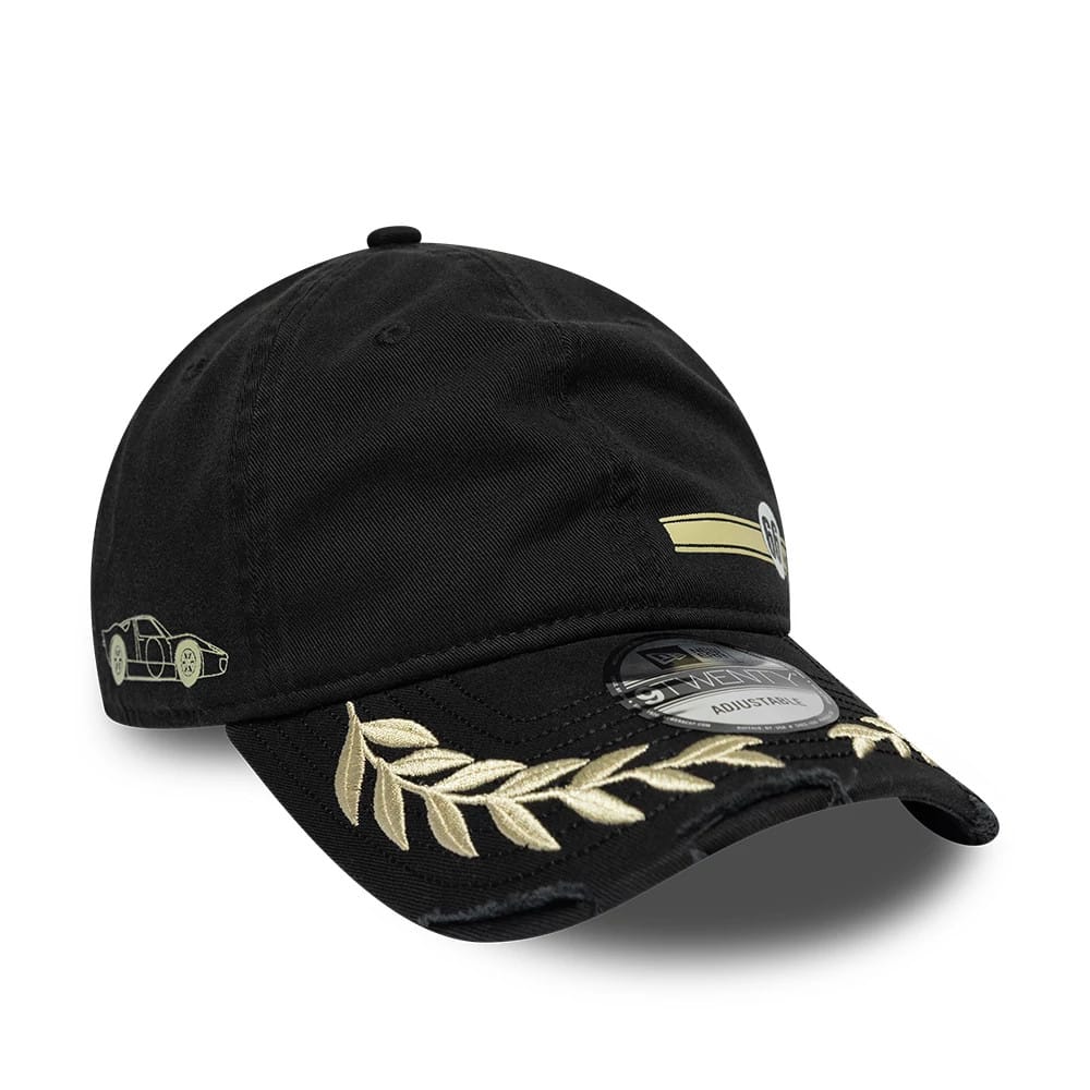 24HR Le Mans Washed Graphic Black New Era 9TWENTY Adjustable Cap, front view showing a gold embroidered laurel design on the distressed black visor, with a 9TWENTY size sticker and a side panel featuring a car graphic.