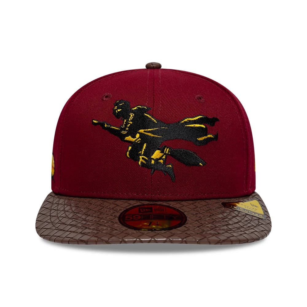 Harry Potter Quidditch Dark Red & Brown New Era 59FIFTY Fitted Cap, front view showing a gold and black embroidered Quidditch player on the structured dark red crown, with a textured brown visor and a gold 59FIFTY size sticker.