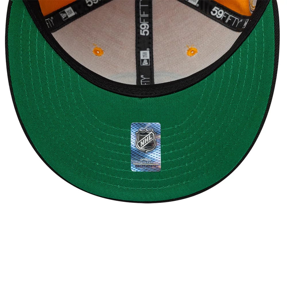 Pictured is this NHL Champions Boston Bruins 59FIFTY Fitted cap in orange. 2