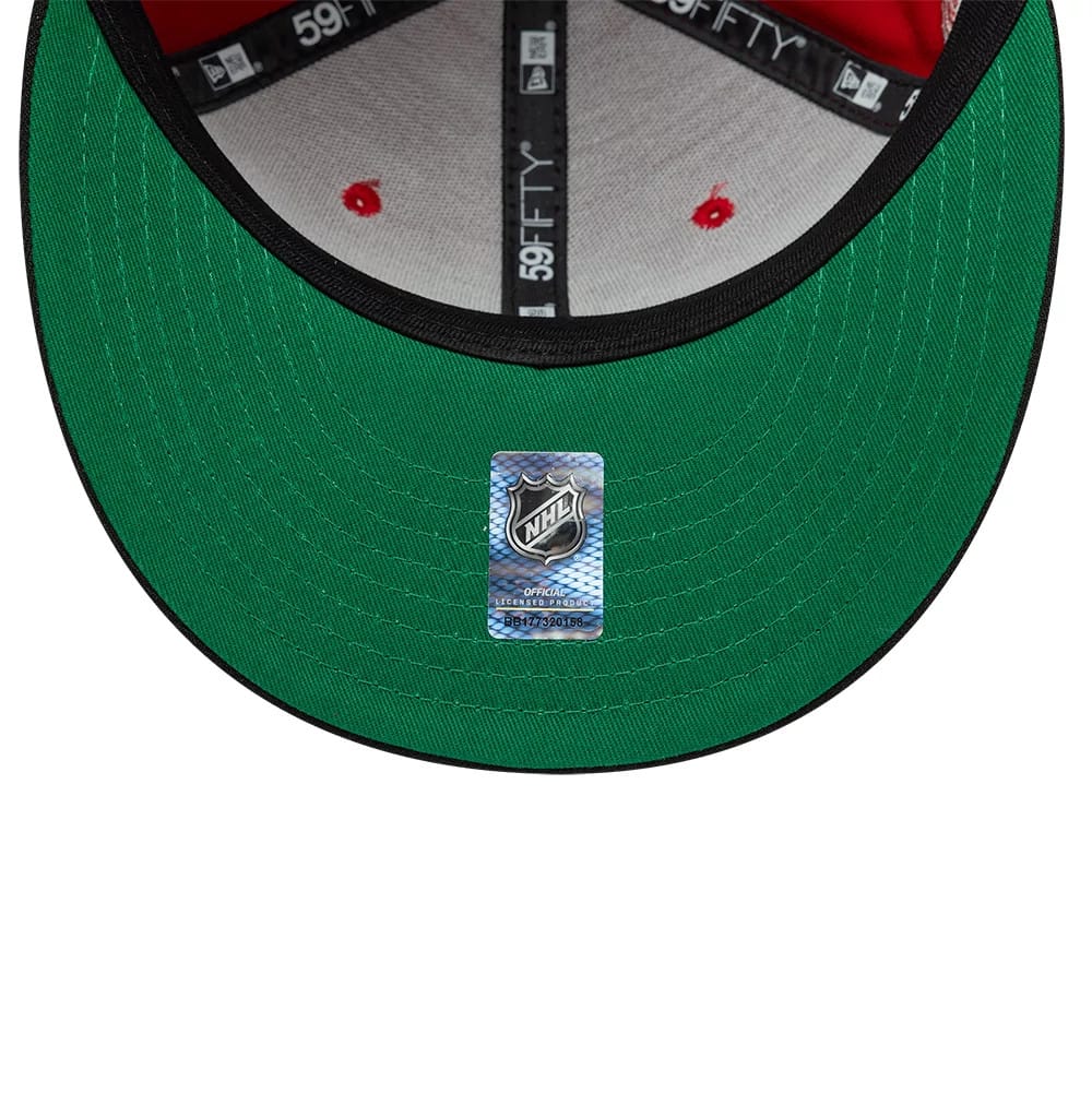 Pictured is this NHL Champions Chicago Blackhawks 59FIFTY Fitted cap in black. 2