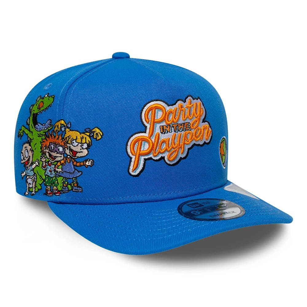 Pictured is this Rugrats Party In The Playpen 9FIFTY A-Frame Snapback cap in blue. 1