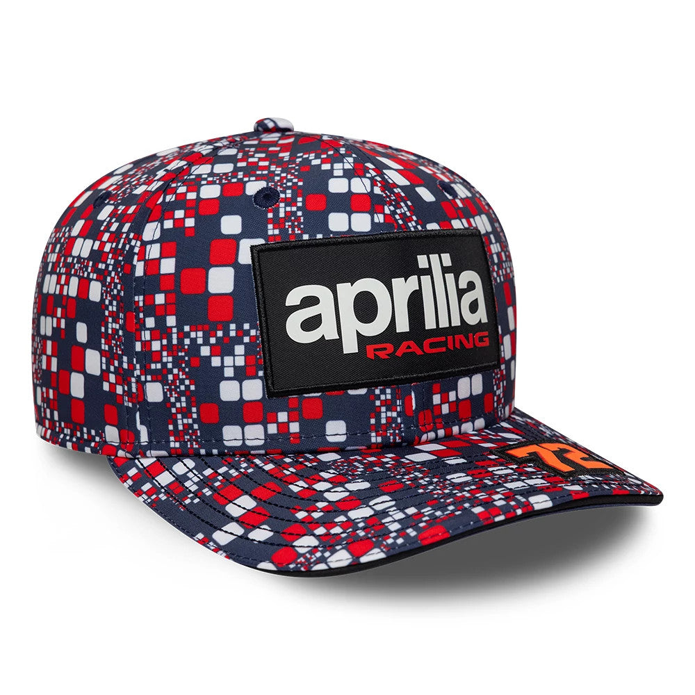 Aprilia Replica Marco Bezzecchi Silverstone Race Special Blue New Era 9SEVENTY Stretch Snap Adjustable Cap, three-quarter view showing a block design with alternating red, white, and navy squares.