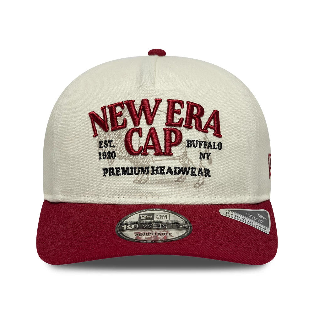 New Era Cream New Era 19TWENTY Adjustable Cap, front view showing raised red embroidery on the cream crown with New Era Cap and Headwear, a contrasting burgundy visor, and a 19TWENTY size sticker on the visor.