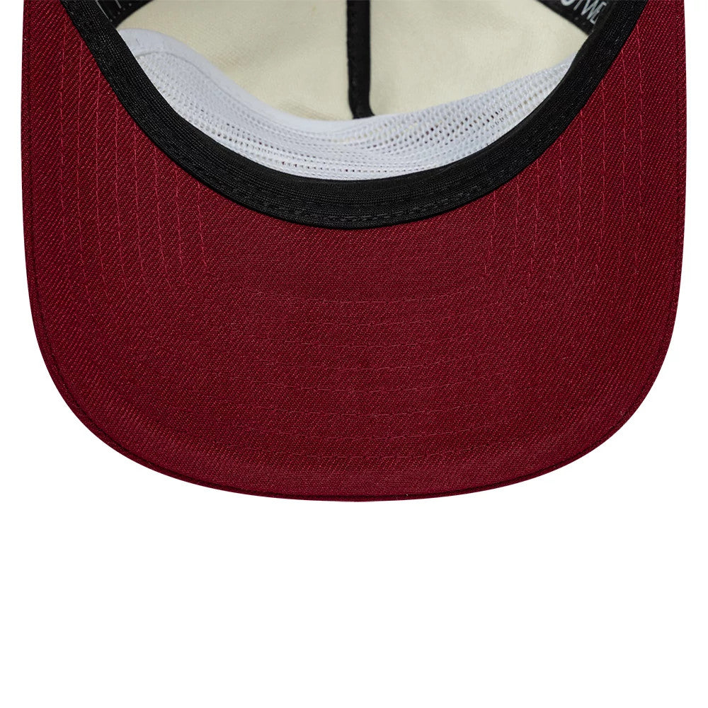New Era Cream 19TWENTY Adjustable Cap, inside view showing the cream-coloured sweatband, a contrasting black taping along the seams, and a deep red undervisor that adds a splash of colour to the cap's interior design.