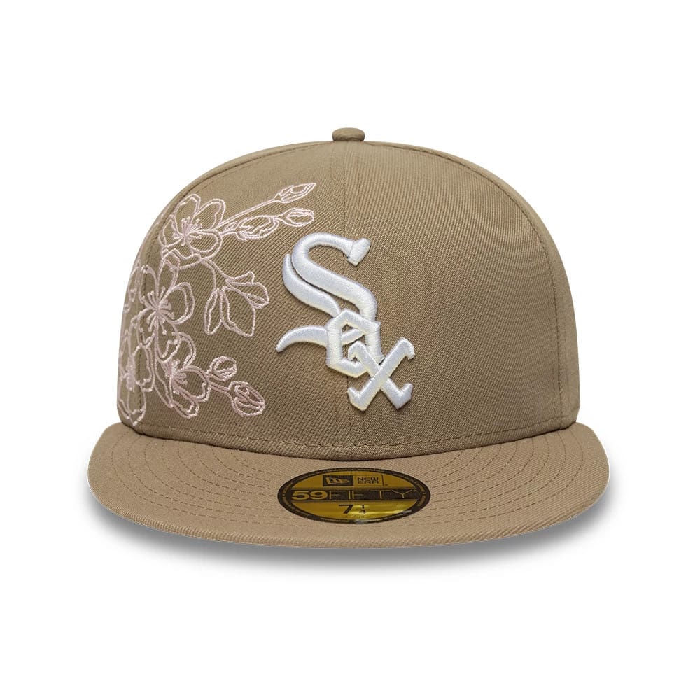 Chicago White Sox MLB Floral Outline Beige New Era 59FIFTY Fitted Cap, front view showing the white raised embroidered Sox logo on the front panel, with a pink floral design on the left side, and a gold 59FIFTY size sticker on the visor.