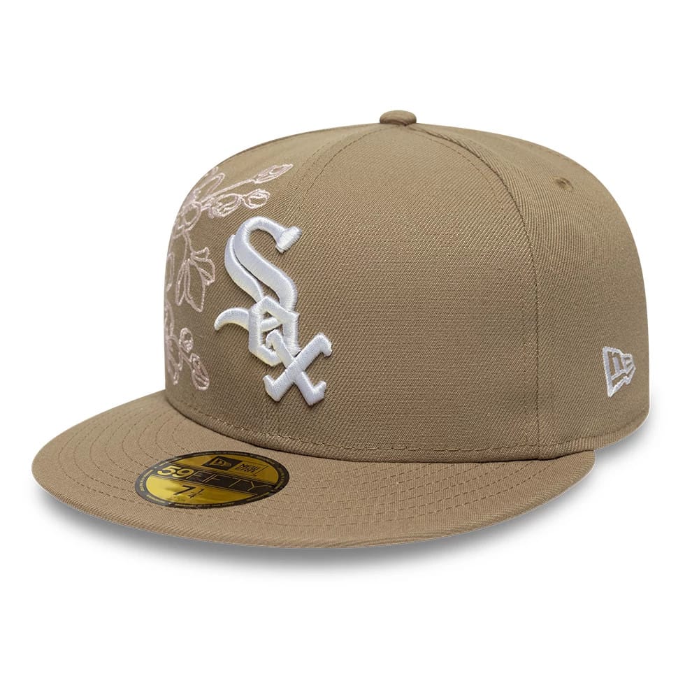 Chicago White Sox MLB Floral Outline Beige New Era 59FIFTY Fitted Cap, three-quarter view showing the white raised embroidered 'Sox' logo on the front panel, floral outline pattern across the side, and New Era flag logo on the left side.