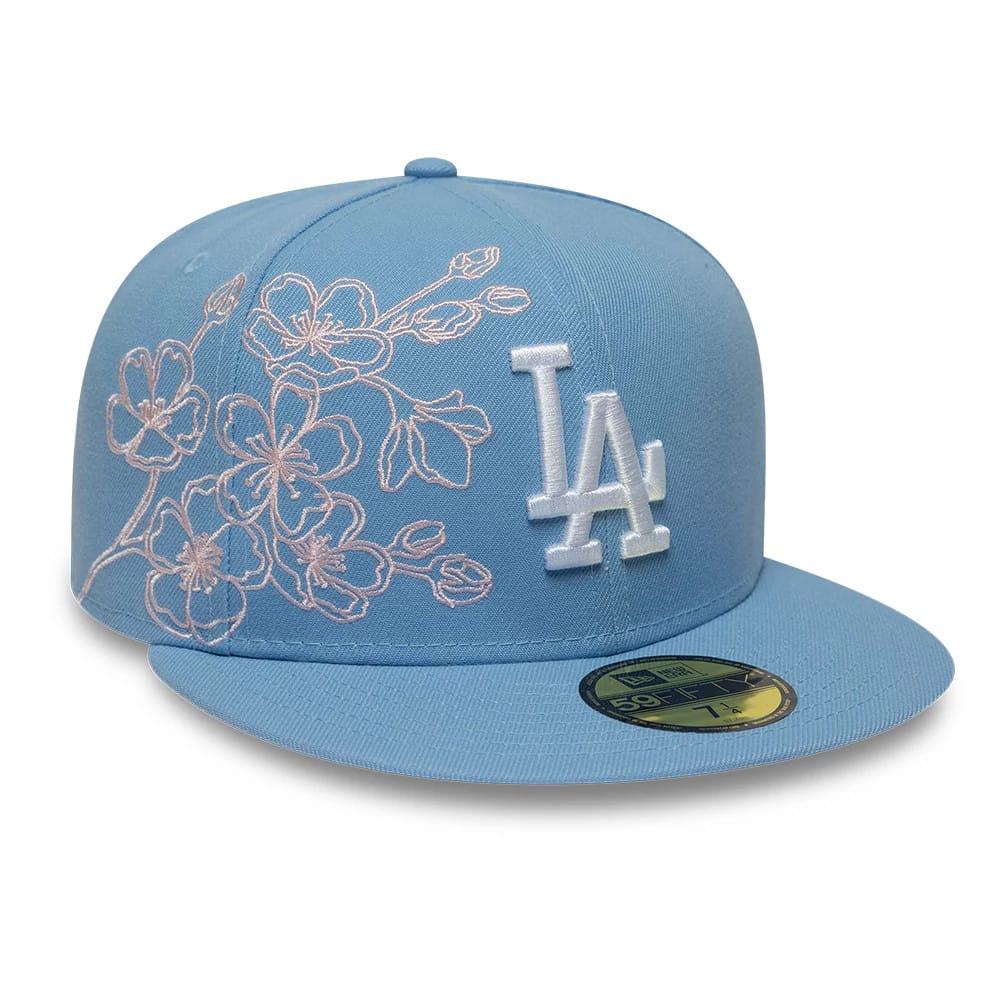 Pictured is this MLB Floral Outline LA Dodgers 59FIFTY Fitted cap in pastel blue. 1