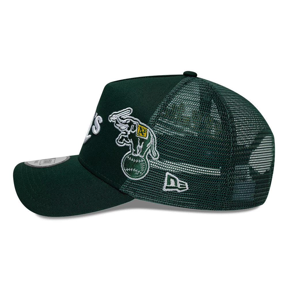 Athletics MLB Patch Dark Green New Era 9FORTY A-Frame Trucker Adjustable Cap, side view showing the white embroidered elephant logo on the green front panel, with the New Era flag logo on the dark green mesh, curved visor and 9FORTY size sticker.