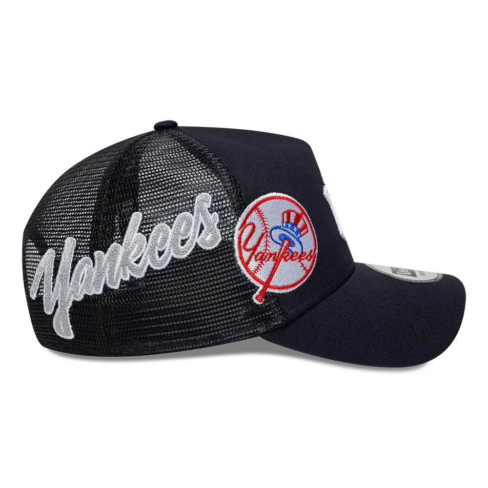New York Yankees MLB Patch Navy New Era 9FORTY A-Frame Trucker Adjustable Cap, side view with a raised red and blue Yankees logo on the front panel, white Yankees script embroidered on the black mesh side, and a navy curved visor.