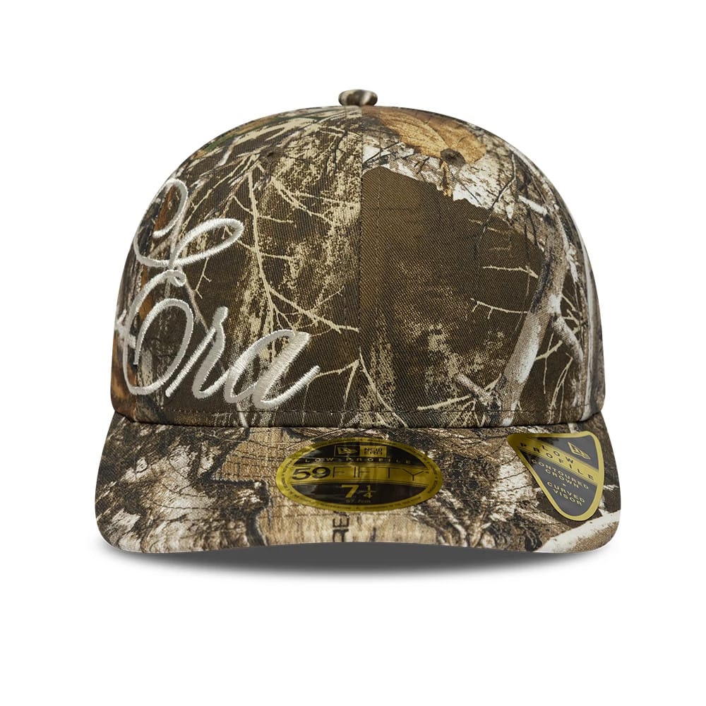 Pictured is this New Era Side Script Low Profile 59FIFTY Fitted cap in Realtree camo. 2