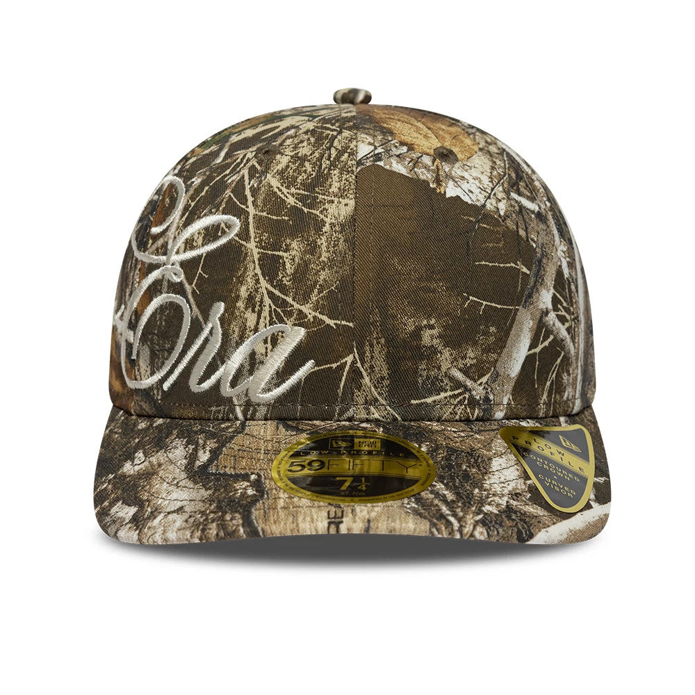 Pictured is this New Era Side Script Low Profile 59FIFTY Fitted cap in Realtree camo. 2