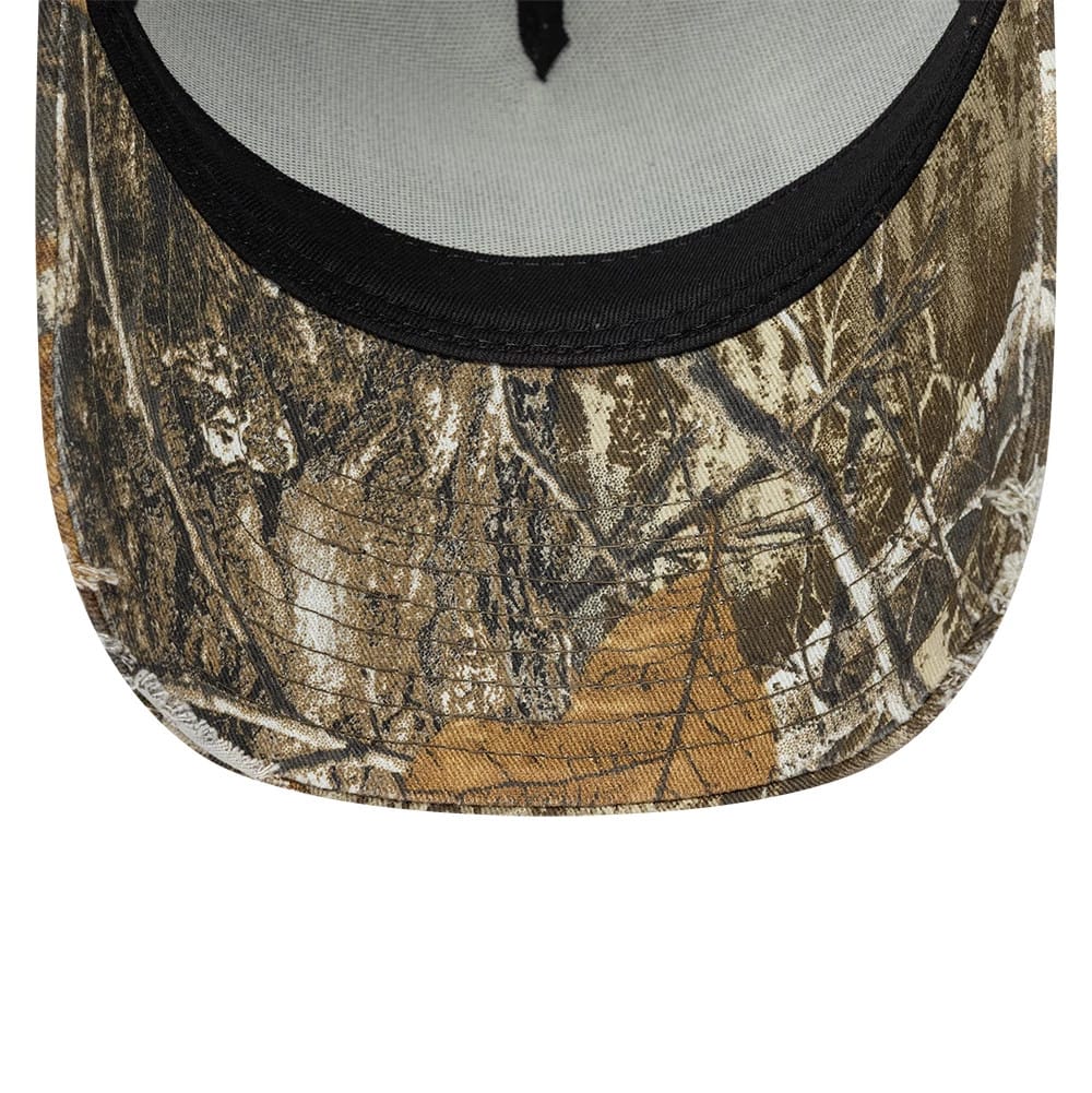 New Era Heritage Patch Realtree Camo 9FORTY A-Frame Trucker Adjustable Cap, inside view showing the black sweatband against the light grey crown lining, with tan camo pattern covering the entire curved visor and front panels.