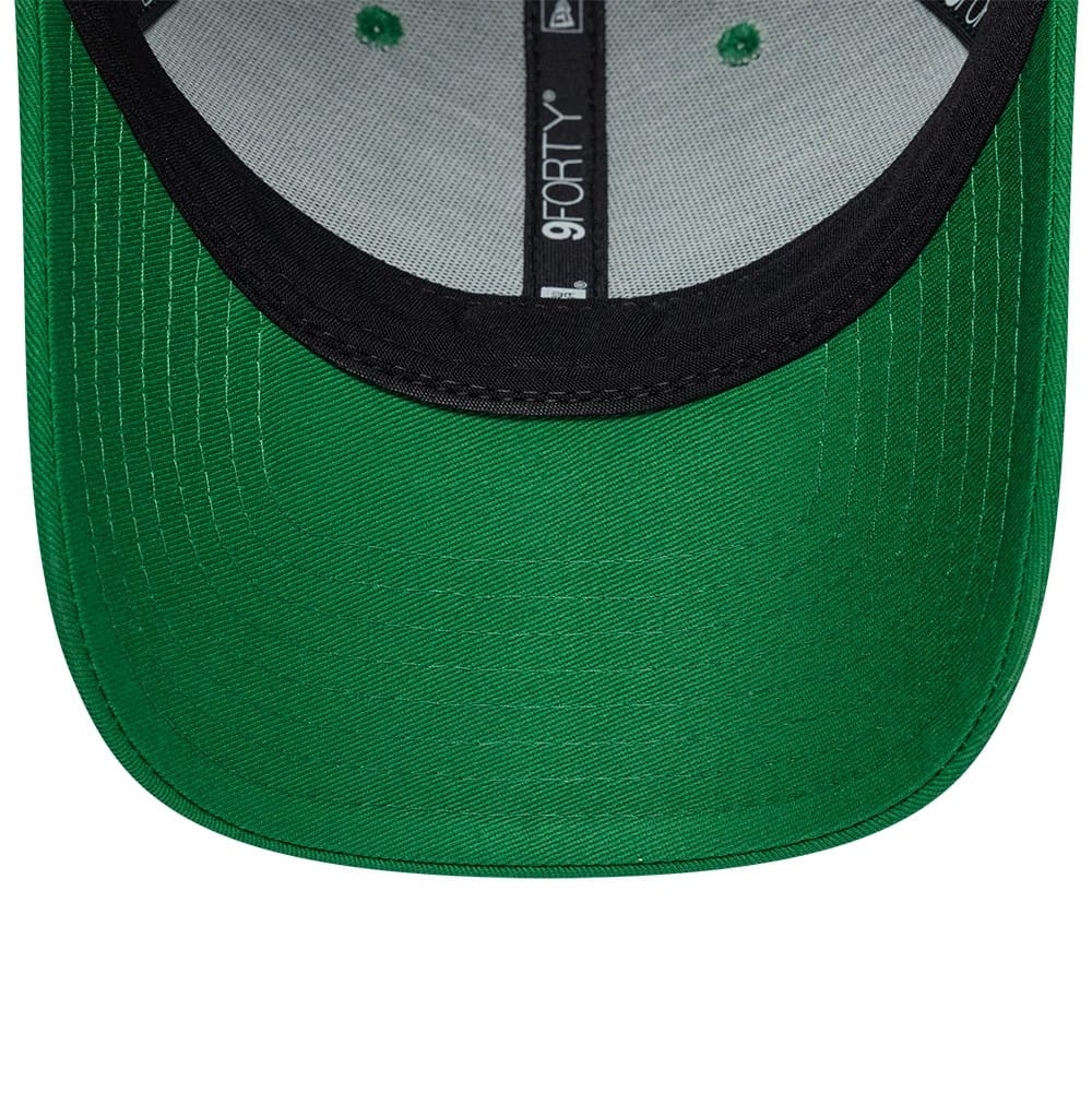 Lacoste X New Era Green 9FORTY Adjustable Cap, inside view showing the black undervisor, grey sweatband, and branded taping with 9FORTY and New Era logo, alongside green fabric and eyelets on the structured panels.
