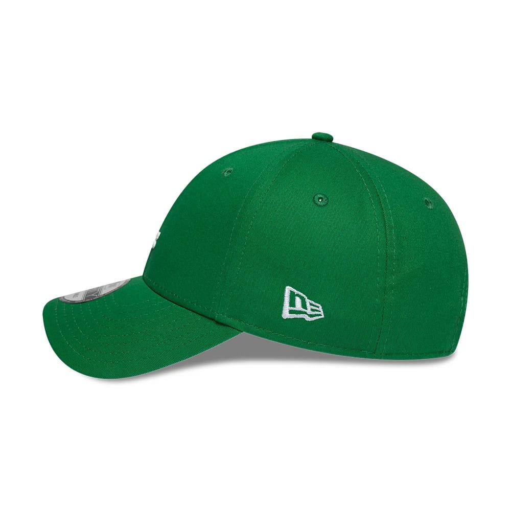 Lacoste X New Era Green 9FORTY Adjustable Cap, side view with the white New Era flag logo embroidered on the left side, a curved green visor, and 9FORTY size sticker on the top of the visor.