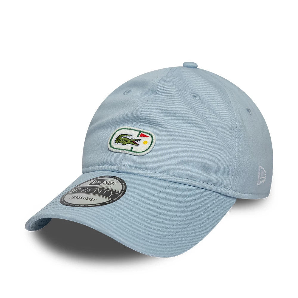 Lacoste X New Era Pastel Blue New Era 9TWENTY Adjustable Cap, front view showing the Lacoste crocodile logo with a red and yellow detail on the front panel, a New Era flag logo on the left side, and a 9TWENTY size sticker on the curved visor.