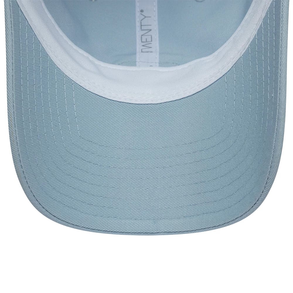 Lacoste X New Era Pastel Blue New Era 9TWENTY Adjustable Cap, inside view showing the light blue undervisor with stitching, white sweatband, and branded taping along the interior for added style and comfort.